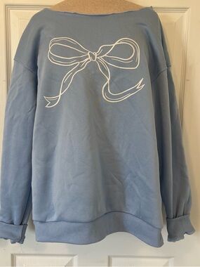 Oversized Light Blue Sweatshirt with White Bow Graphic